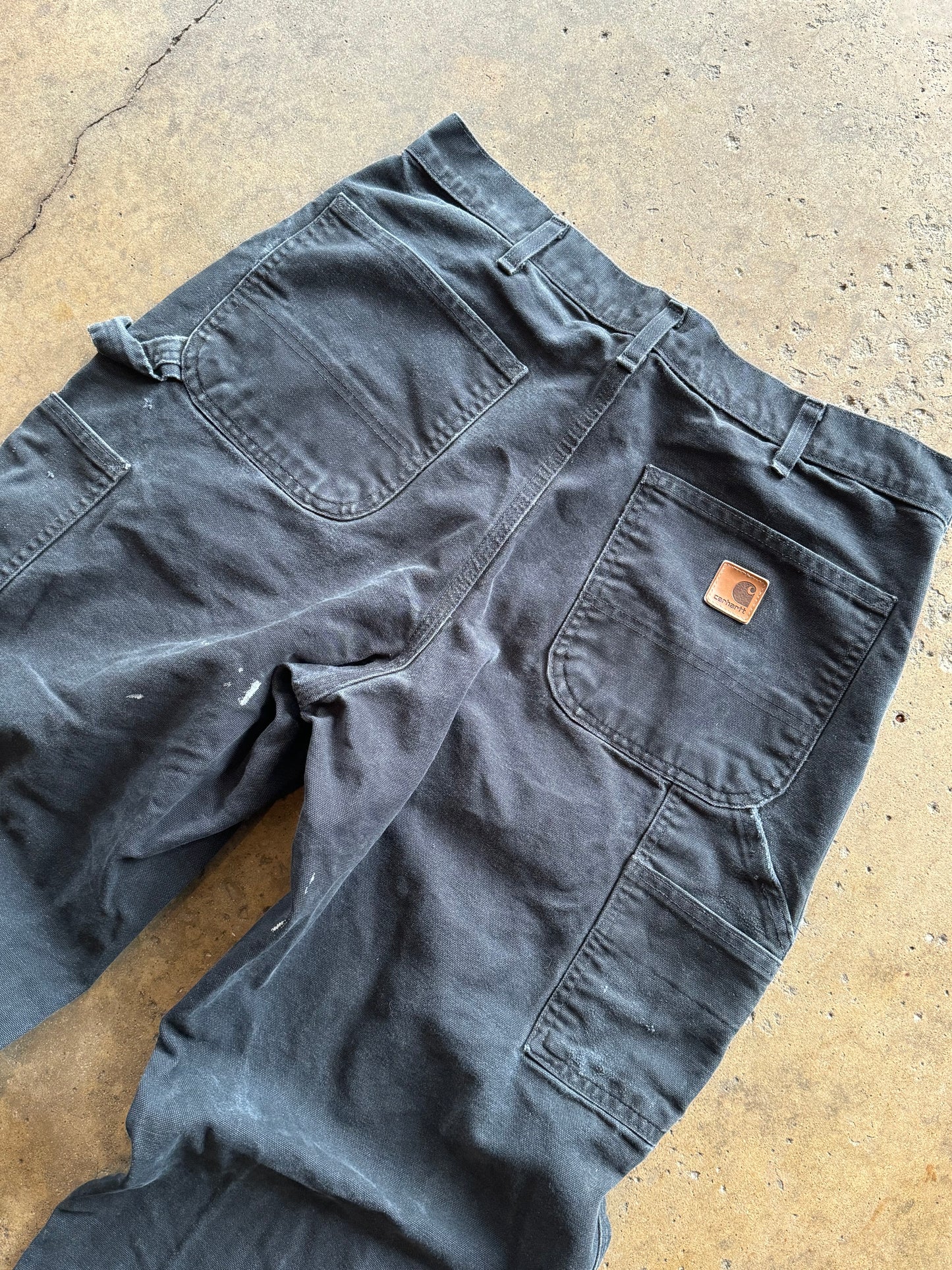 34 - Faded and Trashed Black Carhartt Carpenter Pants